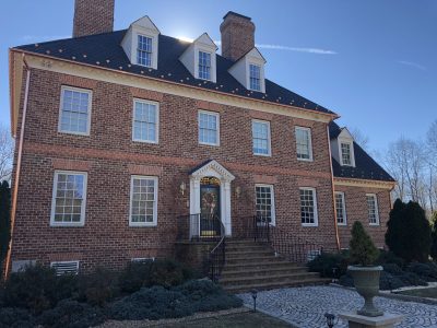 Copper gutters installed on a brick home
